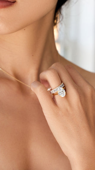 Emerald moissanite eternity band paired with oval engagement ring